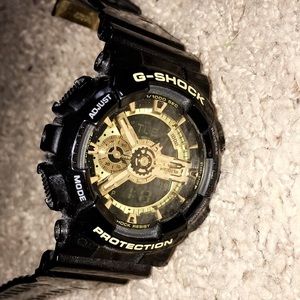 G-Shock black and gold watch